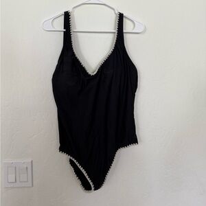 Black women’s One piece plunge swimsuit.